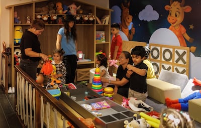 The play area has dedicated staff and plenty of books and toys. Photo: Rodeo Drive