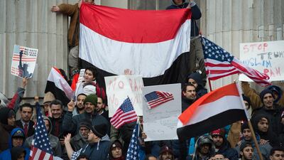 People rally with flags in New York to protest president Donald Trump's executive order banning immigrants and refugees from seven Muslim-majority countries. Some 1,250 Yemenis have been granted a reprieve from possible expulsion back to their war-torn country. AFP/Bryan R. Smith