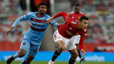Mason Greenwood holds off the challenge of West Ham midfielder Declan Rice during United's FA Cup fifth-round win on February 9. EPA
