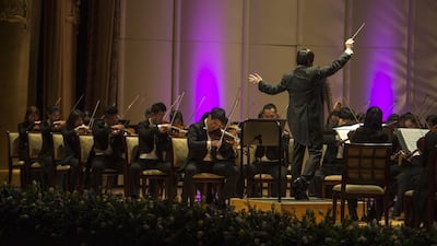 Conductor Yi Zhang leads China's National Centre for the Performing Arts Orchestra at Emirates Palace. Courtesy Abu Dhabi Festival