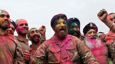 Soldiers from the Defence Sikh Network and British Army take part in Holla Mohalla, the annual Sikh military festival, at the Royal Military Academy at Sandhurst, UK. AFP