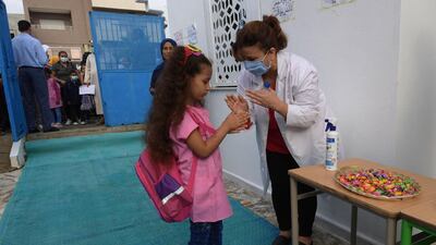 Tunisian pupils arrive at primary school in the Ariane region near Tunis. AFP