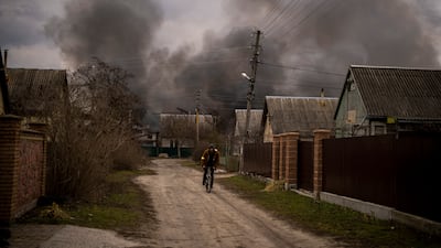 Smoke rises after a building was struck during Russia's military offensive in Irpin on Sunday. AP