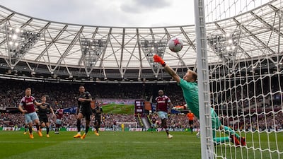 Jarrod Bowen of West Ham United scores his team's second goal past Aaron Ramsdale of Arsenal during the 2-2 Premier League draw at London Stadium on April 16, 2023 in London, England. Getty Images