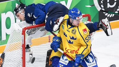 Finland's Otto Karvinen finds himself in an unusual position during the Karjala Cup clash against Sweden on Sunday, November 8. Reuters