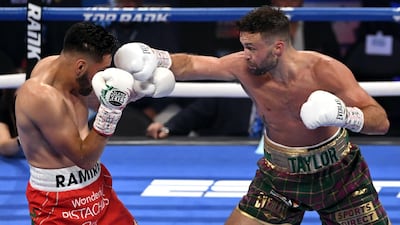 Josh Taylor aims a punch at Jose Ramirez. AFP