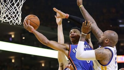 Russell Westbrook #0 of the Oklahoma City Thunder goes up for a shot against Marreese Speights #5 of the Golden State Warriors in Game Seven of the Western Conference Finals during the 2016 NBA Playoffs at ORACLE Arena on May 30, 2016 in Oakland, California. Ezra Shaw/Getty Images/AFP