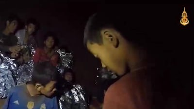 A video grab handout made available by Thai Royal Navy shows some of the members of the trapped football team. Royal Thai Navy / EPA