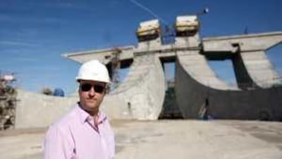 Nigel Clifford, the senior project manager, in front of the Sheikh Zayed Bridge as it enters into the last few months of construction.