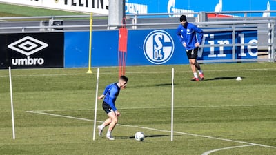 Schalke players take part in drills at the club's training ground in Gelsenkirchen while maintaining social distancing due to the coronavirus outbreak. AP Photo