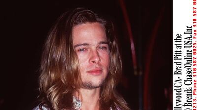 Brad Pitt, in a paisley shirt, at the 'True Romance' premiere in Hollywood, California, on August 9, 1993. Getty Images