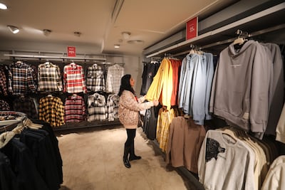 A Palestinian woman buys a gift from a store in Gaza City for Valentine's Day, but there is generally weak demand for gifts in the city. Majd Mahmod/The National