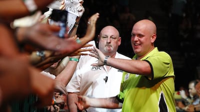 Michael van Gerwen meets his adoring fans during the Finals match for the Dubai Masters Darts Championship. Jeffrey E Biteng / The National