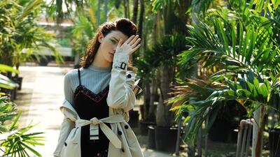 Urban Jungle: Knitted dress (worn underneath), Dh595, Cos. Strappy dress, Dh5,775, Etro. Trench coat, Dh7,995, Burberry. Shoes, Dh1,828, Stuart Weitzman