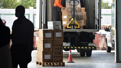 Boxes containing the Pfizer-BioNTech vaccine are unloaded at a vaccination centre in the Saudi capital Riyadh. AFP