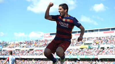 Luis Suarez of Barcelona celebrates scoring his team's second goal during the La Liga match between Granada and Barcelona at Estadio Nuevo Los Carmenes on May 14, 2016 in Granada, Spain. Denis Doyle/Getty Images