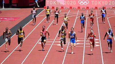 From left: Canada's Andre De Grasse, Ghana's Joseph Paul Amoah, Denmark's Frederik Schou Nielsen, Germany's Lucas Ansah-Peprah, Italy's Filippo Tortu, China's Wu Zhiqiang and USA's Cravon Gillespie compete in the men's 4x100m relay heats.