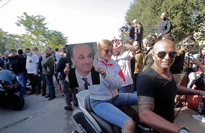 Supporters of the Lebanese Forces (LF) leader Samir Geagea gather in front of the ex-warlord's home in his mountain bastion of Maarab on October 27, 2021. AFP