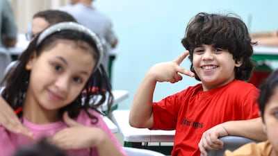 Young Palestinians are delighted to be back at school following a year of turmoil
