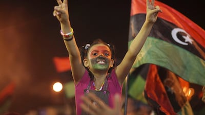 People celebrate what they believe is the nearly end of the military conflict against Gadhafi's regime at the rebel-held town of Benghazi, Libya, early Tuesday, Aug. 23, 2011. World leaders said Monday the end is near for Moammar Gadhafi's regime and began looking at Libya's future without the man who has held power there for 42 years. (AP Photo/Alexandre Meneghini)