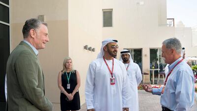 Sheikh Mohammed bin Zayed, Crown Prince of Abu Dhabi and Deputy Supreme Commander of the UAE Armed Forces, centre, meets with Chase Carey, chairman and CEO of Formula 1 Group, right, on the second day of the Formula 1 Etihad Airways Abu Dhabi Grand Prix. They are seen with Al Tareq Al Ameri, the CEO of the Yas Marina Circuit, back centre. Mohamed Al Hammadi / Crown Prince Court - Abu Dhabi