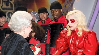Meeting Queen Elizabeth II following the Royal Variety performance in Blackpool, England, the singer wore a Atsuko Kudo latex gown which took two weeks to construct. AFP