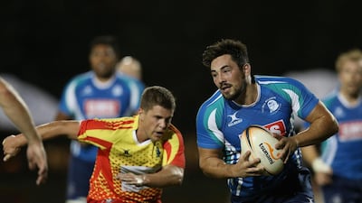 Douglas Steel, right, of Abu Dhabi breaks away with the ball. A sight to see. Francois Nel / Getty Images