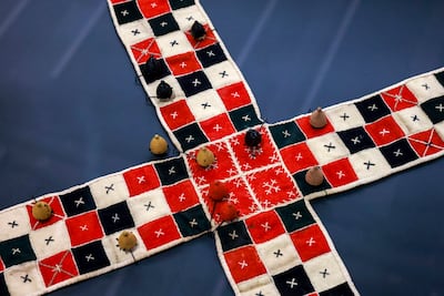 Pachisi, a centuries-old Indian race game that inspired Ludo, is among the games featured in A Board Game Adventure. Victor Besa / The National