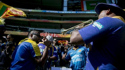 A Sri Lankan papare band sounds the trumpet as spectators dance during the 2015 ICC Cricket World Cup Pool A group match between Sri Lanka and Bangladesh at Melbourne Cricket Ground, Australia on February 26, 2015. Shutterstock