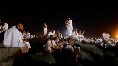 Pilgrims pray on Mount Arafat. Reuters