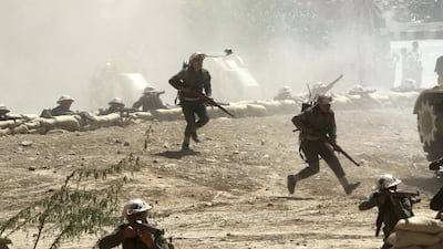 Jordanian troops simulate a military exercise from a historic battle with Israel in Al Karama, in the Jordan Valley. The National
