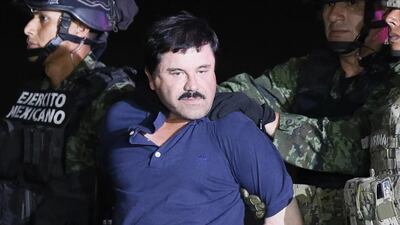 Fugitive Mexican drug lord Joaquin 'El Chapo' Guzman is escorted by the authorities to a Mexican Army helicopter in Los Mochis, Sinaloa, Mexico, on January 8, 2016. EPA