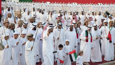 Sheikh Mohammed bin Zayed, Crown Prince of Abu Dhabi and Deputy Supreme Commander of the Armed Forces, dances during the Sheikh Zayed Heritage Festival. Seen with Sheikh Zayed bin Mohammed bin Hamad bin Tahnoon, Sheikh Khalifa bin Tahnoon bin Mohammed, Director of the Martyrs' Families' Affairs Office of the Abu Dhabi Crown Prince Court, and other dignitaries. Mohamed Al Suwaidi / Crown Prince Court - Abu Dhabi
