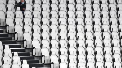 A supporter sits in the stands before the cancelled the Serie A match between Juventus and Napoli. Getty Images