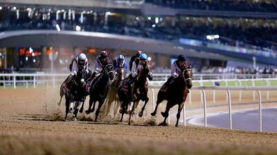Meydan Racecourse opened its season, the race track's first on dirt, on Thursday night in Dubai. Satish Kumar / The National