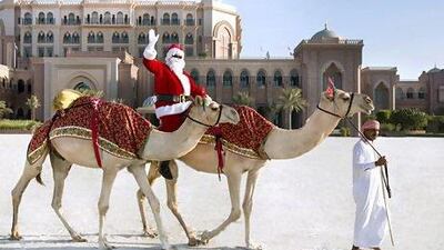 Santa arrives in Abu Dhabi on a camel. Courtesy Emirates Palace