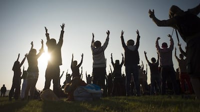Revellers perform yoga as they celebrate the summer solstice on Salisbury Plain. Stonehenge is a celebrated venue of festivities during the summer solstice — the longest day of the year in the northern hemisphere — and it attracts thousands of revellers, spiritualists and tourists. Druids, a pagan religious order dating back to Celtic Britain, believe Stonehenge was a centre of spiritualism more than 2,000 years ago. Kieran Doherty / Reuters