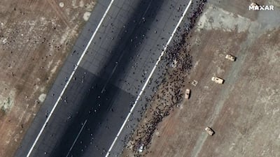 Crowds on the tarmac of Kabul International Airport, Afghanistan, on August 16, 2021. EPA