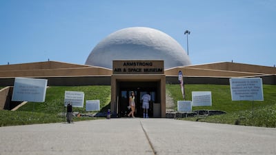 Visitors linger outside the Armstrong Air & Space Museum in Wapakoneta, Ohio. All photos by AP Photo
