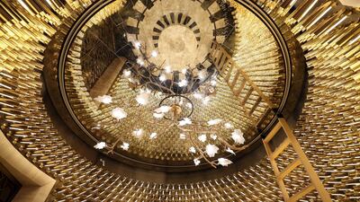 Gold detailing and a sparkling chandelier at The St Regis Dubai, The Palm.