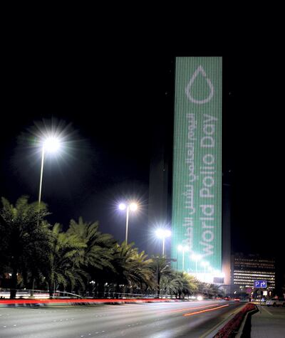 The Abu Dhabi National Oil Company building displayed a striking message of support for World Polio Day. Victor Besa/The National Section