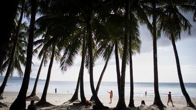 Tourists visit the beach on Boracay. AFP
