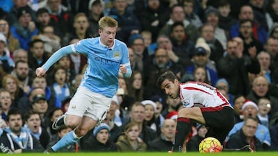 Manchester City's Kevin De Bruyne dribbles past Sunderland's Jordi Gomez on Saturday during his team's Premier League victory at the Etihad Stadium. Jason Cairnduff / Action Images / Reuters / December 26, 2015