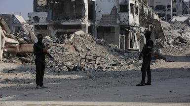 Fighters with Al Qassam Brigades, the military wing of Hamas, on patrol in Gaza. EPA