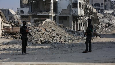 Fighters with Al Qassam Brigades, the military wing of Hamas, patrol in Gaza. EPA