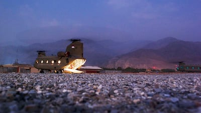 Light emanates from the inside of a CH-47 Chinook helicopter as it waits for passengers at FOB Joyce in Afghanistan's Kunar Province July 5, 2012. Picture taken July 5, 2012. REUTERS/Lucas Jackson
