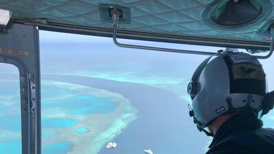 Paramedics rescue a man after a shark attack near the Great Barrier Reef in Australia. RACQ CQ Rescue Twitter