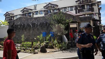 Police officers guard the condominium building that sustained heavy damage after a 6.5 magnitude earthquake in Davao City, Mindanao, Philippines, October 31, 2019. REUTERS/Lean Daval Jr