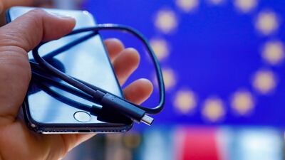 An iPhone with a USB-C cable. The EU has decided all smartphones sold in the bloc, including the iPhone, must be equipped with the USB-C port for wired charging by the autumn of 2024. EPA