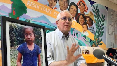 Ruben Garcia, director of an immigrant shelter in El Paso, Texas, speaks to reporters beside a photo of Jakelin Caal on December 15, 2018. The El Paso Times via AP